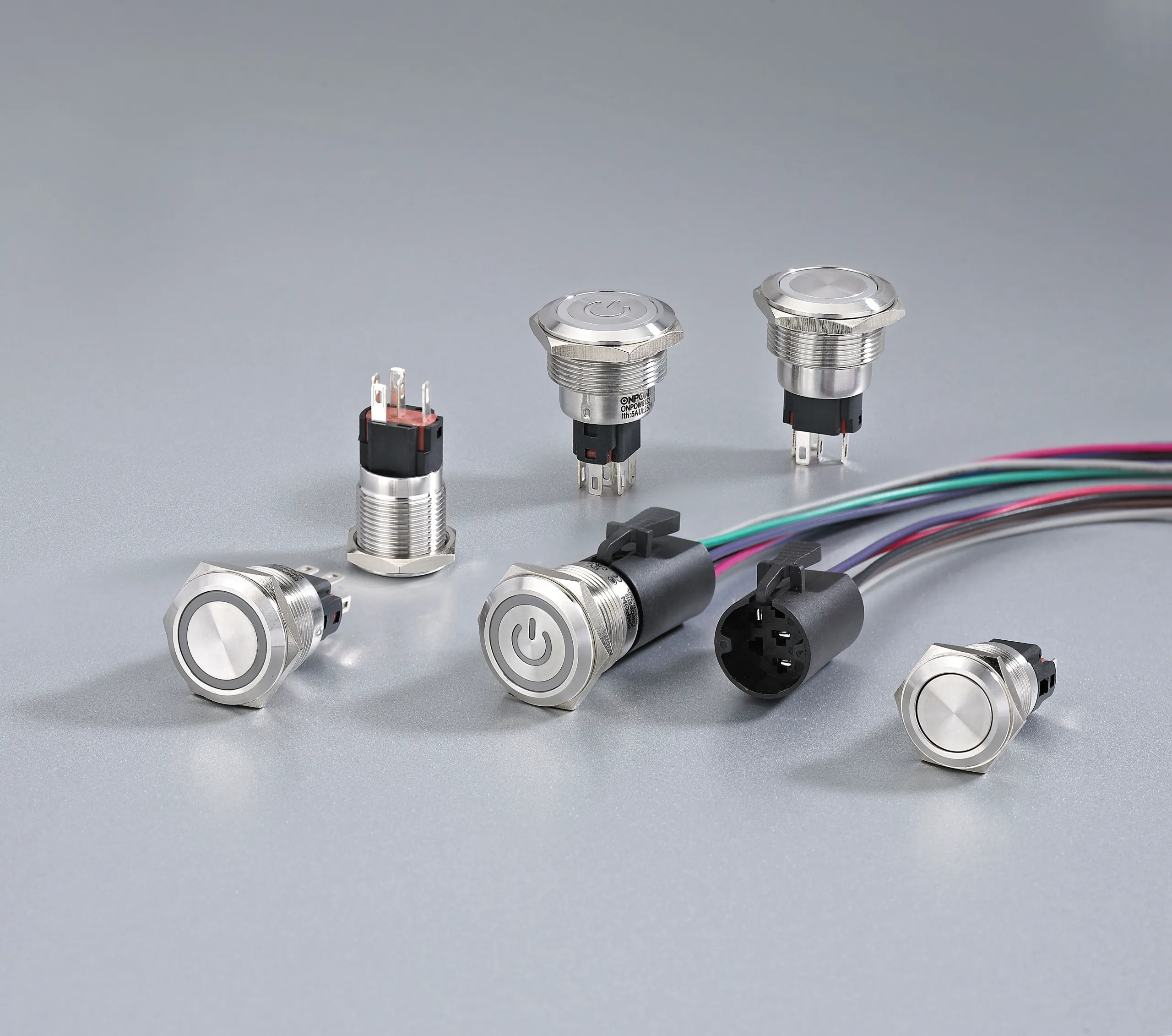 Push button switch kit showing actuator body and mounting hardware