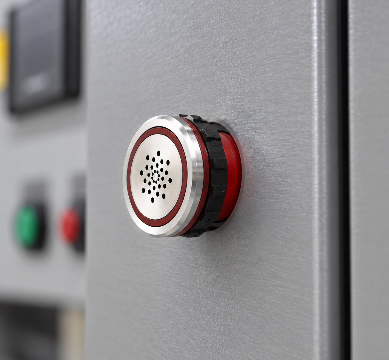 Close side view of a red ONPOW panel buzzer mounted on an indoor equipment cabinet