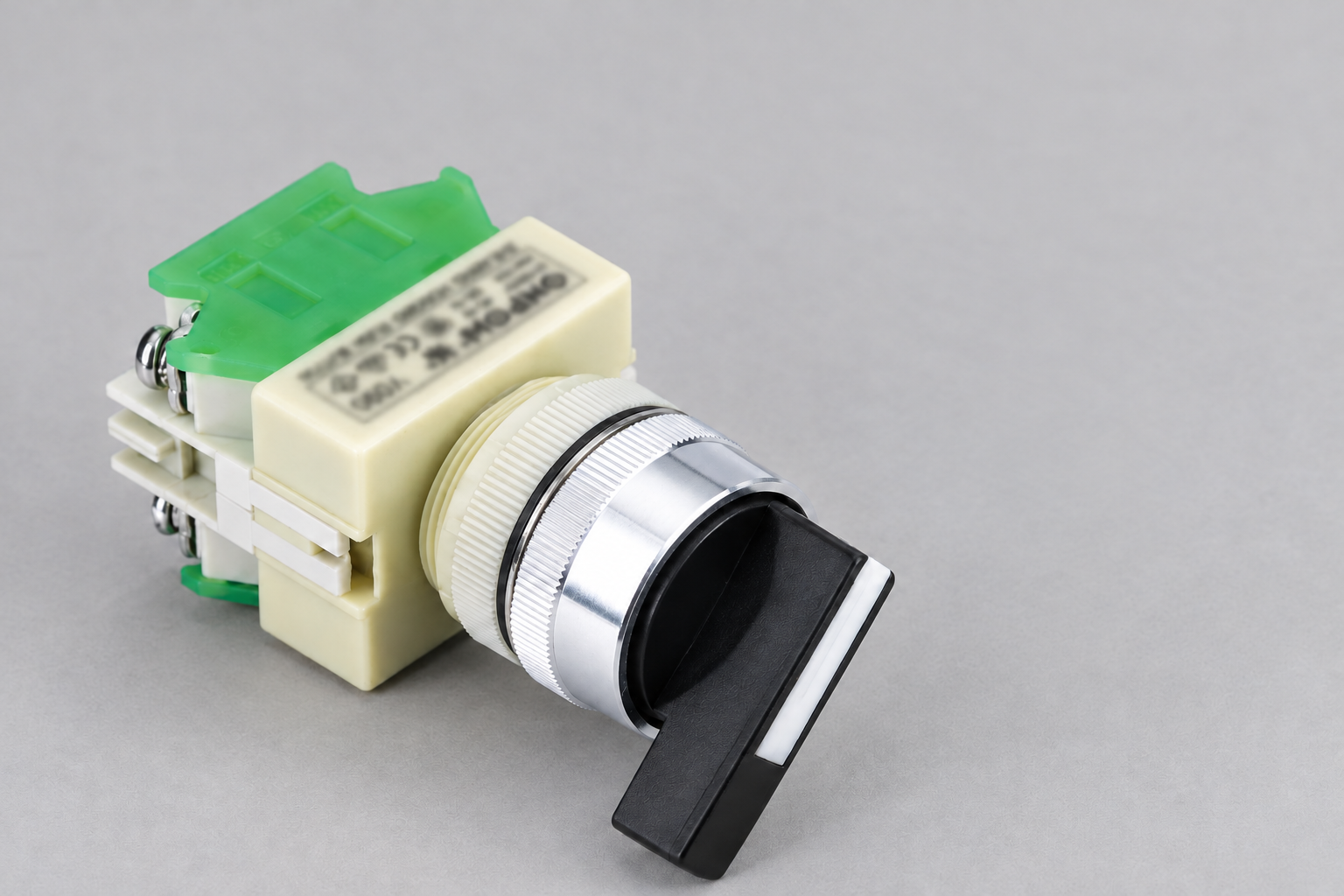 ONPOW rotary selector with black knob, silver mounting collar, cream contact housing and green caps, disconnected