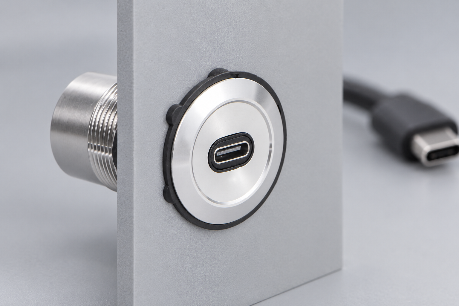 USB-C connector mounted through a flat metal panel
